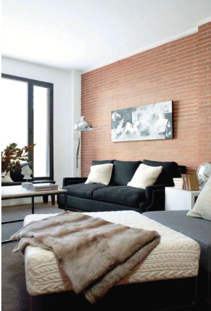 Furs and knitted throws and cushions make this loft apartment cozier.