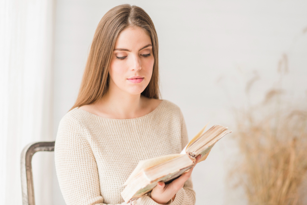 Woman reading a self help book